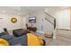 Stylish living room with gray sectional sofa, view of the stairway, and modern decor at 6957 E Osborn Rd # A, Scottsdale, AZ 85251