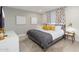Comfortable main bedroom with soft lighting, decorative pillows and modern decor at 6957 E Osborn Rd # A, Scottsdale, AZ 85251
