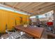 Cozy covered patio featuring a dining table, chairs, cacti, and barbecue at 6957 E Osborn Rd # A, Scottsdale, AZ 85251