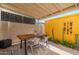 Charming outdoor patio area with tile floor, table and chairs at 6957 E Osborn Rd # A, Scottsdale, AZ 85251