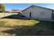 The home has a backyard with a rock bed and grass area at 7232 W Zak Rd, Phoenix, AZ 85043