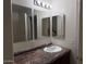This bathroom has a large countertop, sink, mirrors, and vanity at 7232 W Zak Rd, Phoenix, AZ 85043