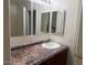Bathroom features a countertop, sink, vanity, and light at 7232 W Zak Rd, Phoenix, AZ 85043