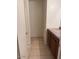Compact bathroom space with a vanity featuring oak cabinets and tile floors at 7232 W Zak Rd, Phoenix, AZ 85043