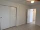 This bedroom has tile flooring and a closet with sliding doors at 7232 W Zak Rd, Phoenix, AZ 85043
