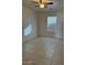 This bedroom has tile flooring and a window at 7232 W Zak Rd, Phoenix, AZ 85043