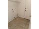 The laundry room features tile floors, utility connections and access to the backyard at 7232 W Zak Rd, Phoenix, AZ 85043