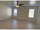 A spacious living room is brightened by two windows, enhancing its appeal at 7232 W Zak Rd, Phoenix, AZ 85043