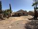 Well kept backyard with neutral color palette, surrounded by palm trees at 7266 E Monte Ave, Mesa, AZ 85209