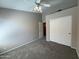 Bedroom with neutral walls, plush carpet, and a ceiling fan at 7266 E Monte Ave, Mesa, AZ 85209