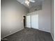 Neutral bedroom featuring sliding door closet, ceiling fan and neutral color palette at 7266 E Monte Ave, Mesa, AZ 85209