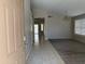 Inviting entryway showcases tile flooring transitioning to carpeted living spaces at 7266 E Monte Ave, Mesa, AZ 85209