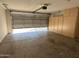 Spacious garage with ample storage cabinets and an automatic door opener at 7266 E Monte Ave, Mesa, AZ 85209