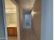 Hallway with tile flooring and view of bathroom and bedroom at 7266 E Monte Ave, Mesa, AZ 85209