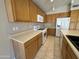 Well-equipped kitchen with a gas range, microwave, and bright cabinets at 7266 E Monte Ave, Mesa, AZ 85209