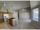 Open floor plan featuring a spacious kitchen with a breakfast bar and access to the living room at 7266 E Monte Ave, Mesa, AZ 85209