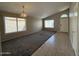 Vaulted ceiling living room with tile entry and carpeted living space at 7266 E Monte Ave, Mesa, AZ 85209