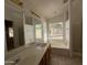 Main bathroom with dual sinks, tub, and shower at 7266 E Monte Ave, Mesa, AZ 85209