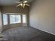 Main bedroom with bay windows, high ceilings and neutral carpet at 7266 E Monte Ave, Mesa, AZ 85209