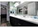 Bright bathroom with a double vanity, ample counter space, and modern fixtures at 7512 W Warner St, Phoenix, AZ 85043