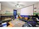 Bright bedroom featuring ceiling fan, large projector screen, and playful decor at 7512 W Warner St, Phoenix, AZ 85043