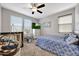 Cozy bedroom with natural light, a ceiling fan, and comfortable decor at 7512 W Warner St, Phoenix, AZ 85043