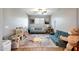 Spacious playroom offering tile floors, ceiling fan, and ample space for activities at 7512 W Warner St, Phoenix, AZ 85043