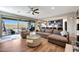 This large living room is open and bright, with a view to the kitchen and outdoor spaces at 7512 W Warner St, Phoenix, AZ 85043