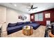 Entertainment room featuring a large sectional sofa, custom round table, and a wet bar at 7512 W Warner St, Phoenix, AZ 85043