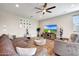 Spacious living room with contemporary decor, a ceiling fan, and wood flooring at 7512 W Warner St, Phoenix, AZ 85043