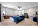 Bright and airy main bedroom featuring large bed, accent bench, and natural light at 7512 W Warner St, Phoenix, AZ 85043