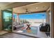 Outdoor patio features seating, a ceiling fan, and views of the surrounding landscape at 7512 W Warner St, Phoenix, AZ 85043