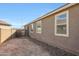 Side yard with rock and back of home at 7512 W Warner St, Phoenix, AZ 85043