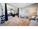 Sitting room featuring a view into the main bedroom with comfortable seating and natural light at 7512 W Warner St, Phoenix, AZ 85043