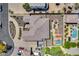 Aerial view of a home showcasing the roof, outdoor space including a pool, and surrounding landscaped yard at 8024 W Vista Ave, Glendale, AZ 85303