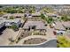 Stunning aerial view showcasing a beautiful community, manicured lawns, and mature trees at 8024 W Vista Ave, Glendale, AZ 85303