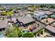 Stunning aerial view of a home with a pool, outdoor kitchen and lush landscaping in a beautiful neighborhood at 8024 W Vista Ave, Glendale, AZ 85303