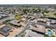 Wide aerial view of a residential neighborhood showing various homes, streetscapes, and the community layout at 8024 W Vista Ave, Glendale, AZ 85303