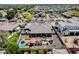 Expansive backyard featuring a pool, pergola, outdoor seating, lush landscaping and citrus trees at 8024 W Vista Ave, Glendale, AZ 85303
