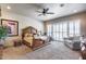 Spacious bedroom features decorative bedframe, fan and bright natural light at 8024 W Vista Ave, Glendale, AZ 85303