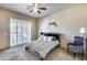 Inviting bedroom features soft carpet, neutral palette, and a plush rug, creating a cozy retreat at 8024 W Vista Ave, Glendale, AZ 85303