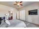 Bedroom showcasing warm colors, neutral carpet, and a view into the bath at 8024 W Vista Ave, Glendale, AZ 85303