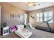 Comfortable bedroom featuring a play area and neutral wall color at 8024 W Vista Ave, Glendale, AZ 85303