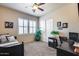Bright bedroom with ceiling fan, neutral walls, and shutters, providing a serene atmosphere at 8024 W Vista Ave, Glendale, AZ 85303