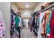 Walk-in closet with extensive shelving and clothing racks at 8024 W Vista Ave, Glendale, AZ 85303