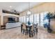 Open-concept living space combining dining and living room, filled with natural light at 8024 W Vista Ave, Glendale, AZ 85303