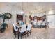 Open-concept living space combining dining and living room, filled with natural light at 8024 W Vista Ave, Glendale, AZ 85303