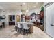 Modern kitchen featuring a large island, granite countertops, stainless steel appliances, and an open layout at 8024 W Vista Ave, Glendale, AZ 85303
