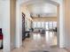 Spacious, open-concept living room with tile floors, abundant natural light, and a seamless flow into the dining area at 8024 W Vista Ave, Glendale, AZ 85303