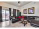 Cozy living room with leather sectional sofa and outdoor patio access at 8024 W Vista Ave, Glendale, AZ 85303